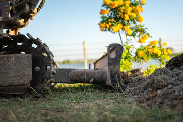 Crawler track or continuous track of the backhoe or excavator vehicle at construction site. Industrial equipment object, close-up. © Nattawit