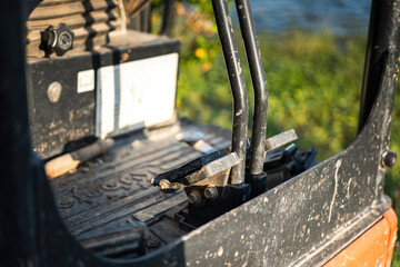 Close-up at gas pedal or throttle foot step of backhoe excavator vehicle. Industrial vehicle object part photo. Selective focus.