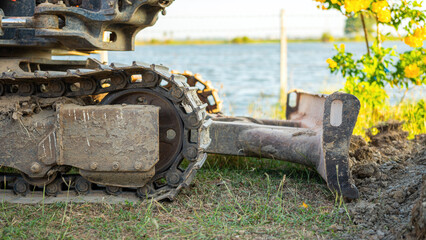 Crawler track or continuous track of the backhoe or excavator vehicle at construction site....