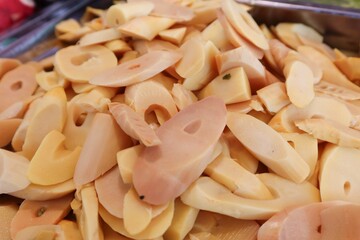 Pickled bamboo shoots, or "Nor Mai Som" as it's called in northeastern Thailand, is a popular Thai food preservation method that extends shelf life and creates a sour flavor.