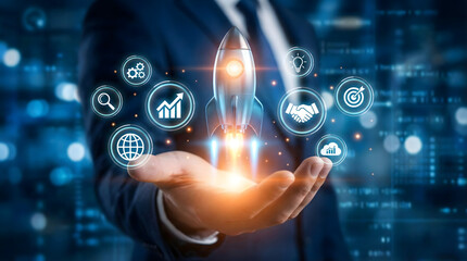 Fototapeta premium Businessman,launching,a,digital,rocket,from,his,hand,surrounded,by,innovation,and,growth,symbols,visualizing,successful,startup,launch,business,expansion,and,attaining,ambitious,corporate,goals.
