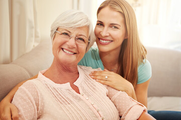 Woman, senior mom and love in portrait for retirement support, care and home in living room. Elderly parent, adult daughter and relax on sofa with hug, appreciation and happy at mothers day visit