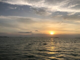 Fototapeta premium Vibrant sunset over calm ocean, retirement bliss, travel, idyllic