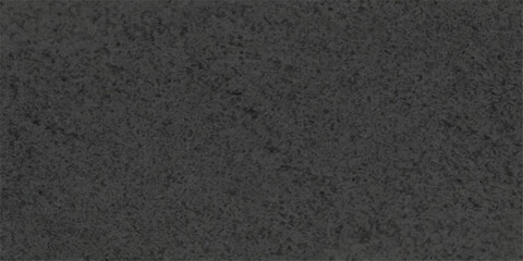 A dark and rough closeup of a black asphalt road surface featuring a textured bitumen pattern and gray stone material suitable for a street backdrop or wallpaper design