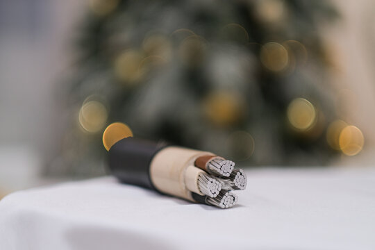 Close up of a large power cable with exposed wires. Cross section of industrial electric cable for distribution and energy concept.