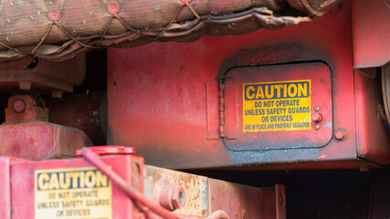 Caution alert sign of the machinery moving part, no hand for accident prevention. Industrial safety...