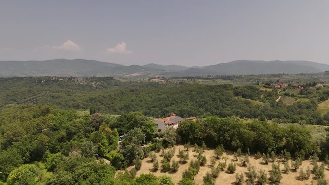 Aerial views of houses on a hill in Impruneta near Florence, Italy, featuring the scenic Tuscan landscape. On a beautiful summers day.