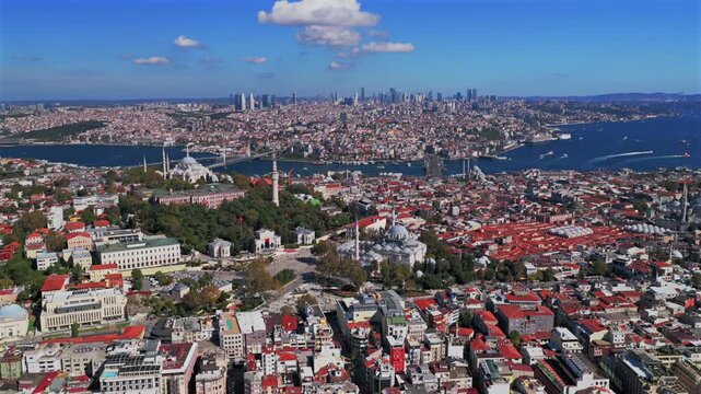 Morning Istanbul Turkey T&uuml;rkiye aerial drone sunny blue clear skies autumn Blue Mosque synagogue temple cityscape skyscrapers Fatih Yenikapı Port Bosphorus Strait Harbor view parallax backwards pan up