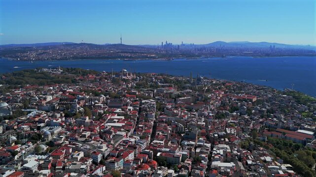 Morning Istanbul Turkey T&uuml;rkiye aerial drone sunny blue clear skies autumn bridge Blue Mosque synagogue temple cityscape skyscrapers Fatih Yenikapı Port Bosphorus Strait Harbor view circle right