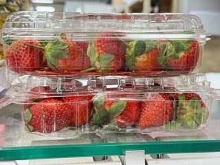 Fresh Strawberries in Plastic Containers on Display