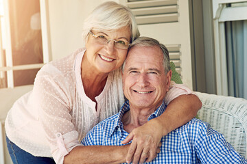 Senior couple, portrait and hug on porch, smile and bonding for love, care and relax on sofa at house. Elderly people, partner and relationship with embrace, happy or pride on patio at New Zealand