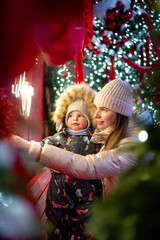 A cheerful mother and son playing outside on New Year&rsquo;s Eve
