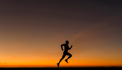 Person running outdoors during a vibrant sunset or sunrise.