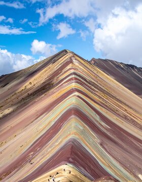 Striking View of Rainbow Mountain in Peru with Colorful Geological Formations.