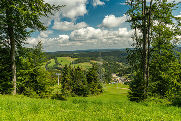 Mountain landscape with green meadows and forested hills in Slotwiny near Krynica Zdroj, Poland