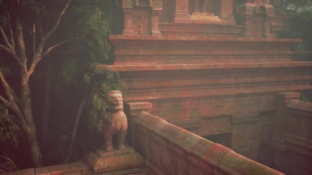 A statue of a lion is positioned on a ledge next to a tree, showcasing a majestic and regal presence.