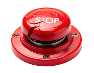 A red stop button showing signs of wear and damage, featuring the word "STOP" prominently on its surface.