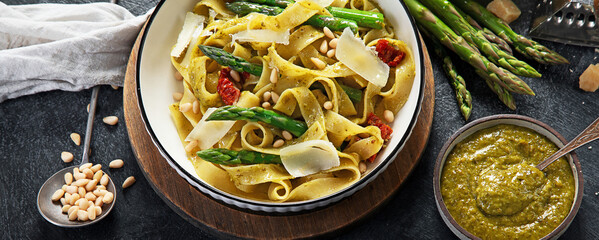 Vegetarian vegan green pasta, Fettuccine pasta with pesto sauce. Healthy food.
