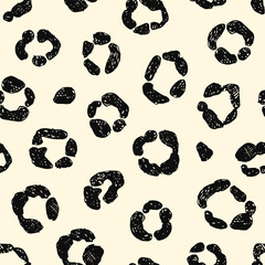 Seamless leopard print. Hand-drawn black half-rings.