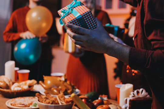 Festive Office Christmas Party with Delicious Food. A beautifully decorated office space with Christmas trees and festive lights, set up for a holiday party.
