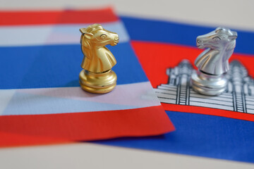 Two knights standing on Thailand and Cambodia flag 
