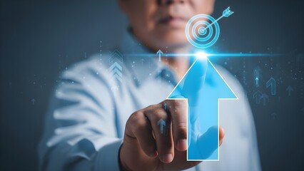 Close-up of a businessman's hand touching a blue arrow graphic with a target and upward trend line against a dark background with a professional and technological mood.