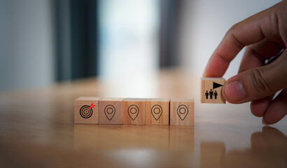 Career Path and Development Strategy Concept. Arranging wooden blocks with icons success roadmap and journey, symbolizing a structured career path and strategic development. Planning, growth, progress