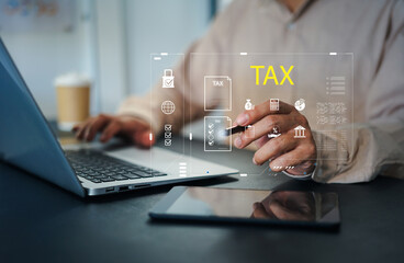Tax calculation and financial accounting concept. Businessman using calculator and laptop with virtual tax icon, bar chart, percentage, money symbol and document for income and business finance.
