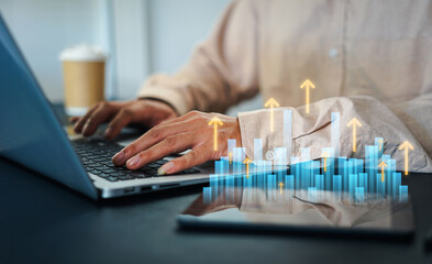Businessman holding digital bar chart with percent icons, symbolizing big data analytics, financial forecasting, interest rate trends, and maximizing profit through smart investment strategies.