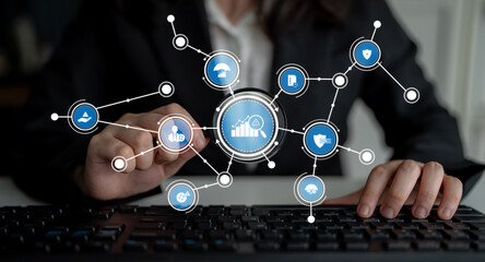 A business professional interacts with a digital interface, showcasing data visualization and analytics, emphasizing technology and growth in a modern workplace. Crux