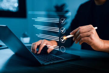 Digital checklist verification on virtual interface as professional reviews tasks on laptop, confirming workflow accuracy, quality control, compliance and approval process for business operations