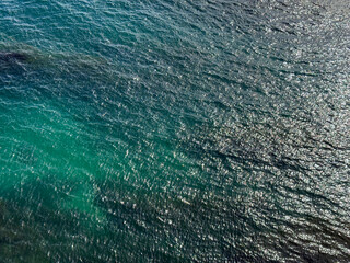 Glittering ocean blue turquoise water surface