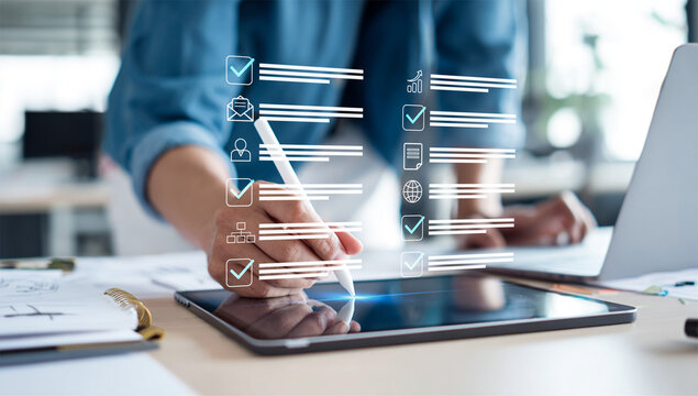 Person Interacting with a Digital Tablet Featuring a Virtual Checklist and Business Icons, Symbolizing Efficient Task Management and Digital Productivity in a Modern Office Setting. - Powered by Adobe