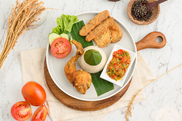 Delicious Indonesian Fried Chicken with Rice and Sambal.