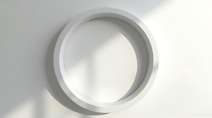 Obraz premium Minimalist White Circular Object Sitting on White Surface with Shadows