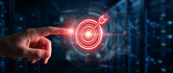Hand Touching a Glowing Digital Target Icon in a Server Room Setting Representing Strategic Goal Achievement and Success