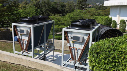 Outdoor double condenser. Energy efficient refrigeration condenser for medium to large sized buildings installed outside with copy space with selective focus.