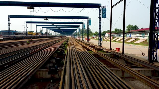 Industrial Railway Yard with Gantry Cranes and Steel Infrastructure