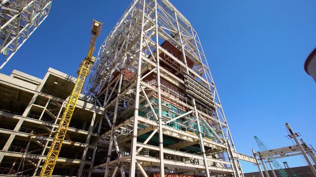 Large Building Construction Site with Steel Framework and Crane