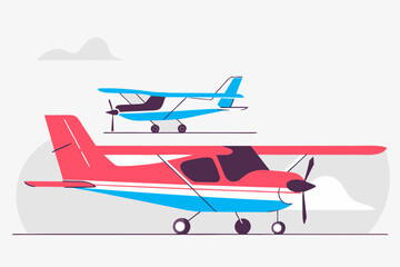 Fototapeta premium Two small planes flying in cloudy sky