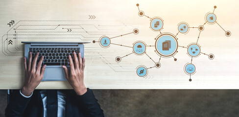 A professional workspace featuring hands on a laptop surrounded by digital network graphics, representing communication, data exchange, and modern technology integration. Tessel