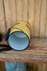 an iron can on a yellow background,