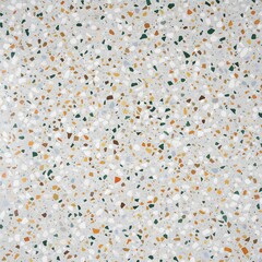 Colorful terrazzo floor design with various shapes and sizes of stones in a bright setting