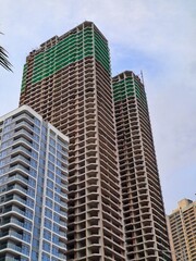 High rise building site showing multiple floors and safety netting during the development phase