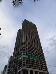 High rise building site showing multiple floors and safety netting during the development phase