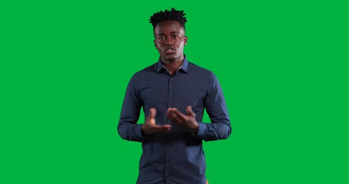 Confident, smiling african american man gesturing and talking camera on transparent background
