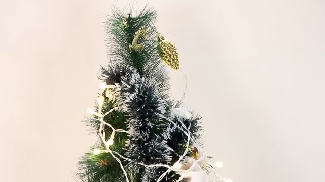Decorated Christmas tree with cake and gifts.