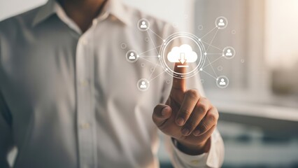 A person in a white shirt points towards a digital cloud icon with network connections