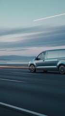 Fototapeta premium Electric delivery van speeding on coastal highway at dusk, clean transport motion, supply chain, global logistics
