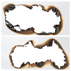 Two sheets of white paper, each with a charred hole burned in the center